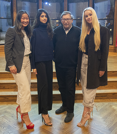 Stuart Weitzman with Clark Students modeling his famous shoe models.